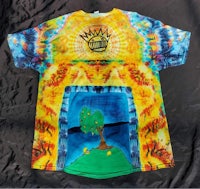 a tie dye t - shirt with a tree on it