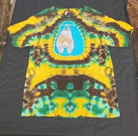 a tie dye t - shirt with an elephant on it