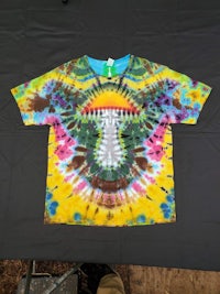 a tie dye t - shirt with a colorful design on it