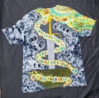 a t - shirt with an image of a snake and a sword