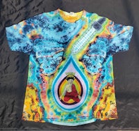 a tie dye t - shirt with an image of a buddha on it