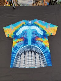 a tie dye t - shirt with a mouth on it